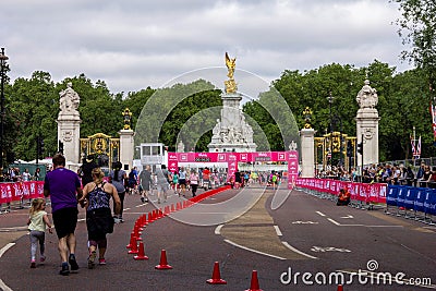 London/England - May 26 2019: A landscape portrait of people running to the finish line of the Vitality London 10k fundraiser run Editorial Stock Photo