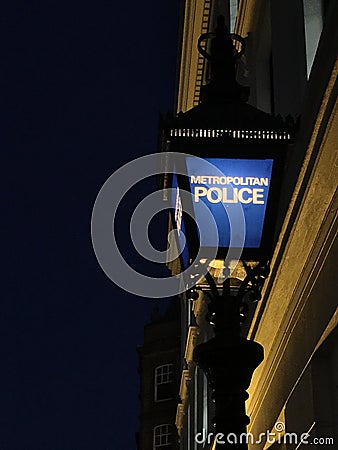 LONDON, ENGLAND Metropolitan Police Sign at night Editorial Stock Photo