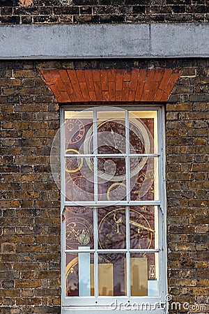 Imagine clocks through a window at the Royal Observatory in Greenwich Editorial Stock Photo