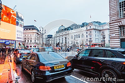 London, England-18 October,2018: Traffic light and people in Piccadilly Circus in London. Famous place for shopping and travel for Editorial Stock Photo