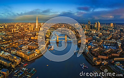 London, England - Panoramic aerial skyline view of London including iconic Tower Bridge with red double-decker bus Stock Photo