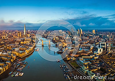 London, England - Panoramic aerial skyline view of London including Tower Bridge with red double-decker bus Stock Photo