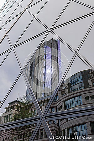 London, England; 05/05/2012: Purple London skyscraper building reflection. Editorial Stock Photo