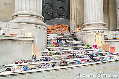 LONDON, ENGLAND- 6th June 2021: Shoes at High Commission of Canada, symbolising discovery of remains of 215 Indigenous children Editorial Stock Photo