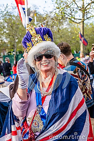 Woaman with a crown and union jack waiting for King Charles III coronation Editorial Stock Photo