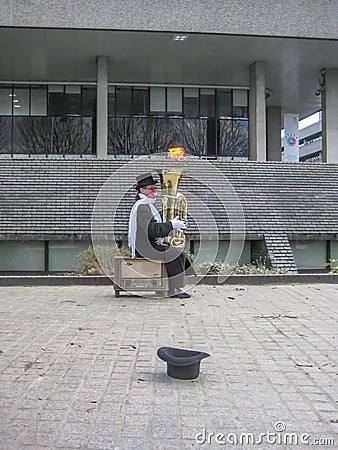 Playing tuba in the streets of London Editorial Stock Photo