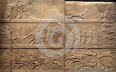 London, United Kingdom - Ancient Assyria clay tablet relief of king Ashurbanipal hunt for lions from his royal palace in Nineveh Editorial Stock Photo