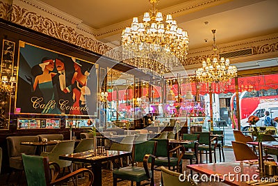 London: Inside upscale Cafe Concerto in Covent Garden with beautiful chandeliers and paintings Editorial Stock Photo