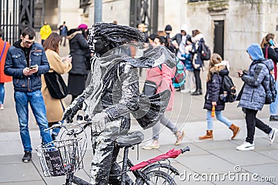London, January 26, 2020. A living statue is a street artist who poses as a statue or mannequin, usually with realistic statue Editorial Stock Photo