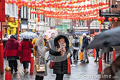 London, January 26, 2020. Spectators taking pictures with cell phones during Chinese New Year Celebrations Editorial Stock Photo