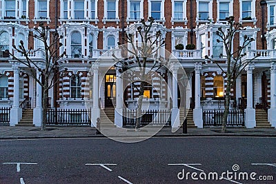 London - March 30: Iconic traditional row of town houses at night in Notting Hill on March 30, 2017 Editorial Stock Photo