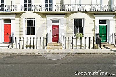 London - March 30: A row of typical town houses in London Kensington with colorful doors on March 30, 2017 Editorial Stock Photo