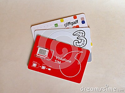 LONDON - OCT 2019: Vodafone, Three and Giffgaff sim cards Editorial Stock Photo