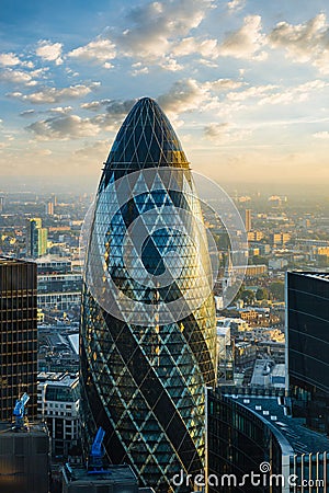 LONDON - OCTOBER 1: Gherkin building (30 St Mary Axe) during sunrise in London on October 1, 2015 Stock Photo