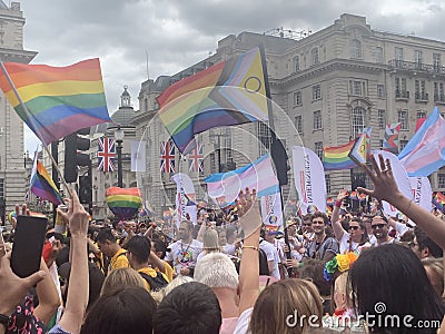 Gay activists with LGBT flags at the Pride parade in London , England 2023 Editorial Stock Photo