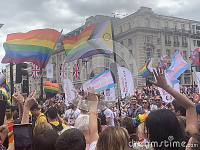 Gay activists with LGBT flags at the Pride parade in London , England 2023 Editorial Stock Photo