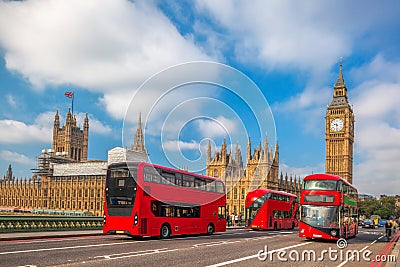 London with red buses against Big Ben in England, UK Stock Photo