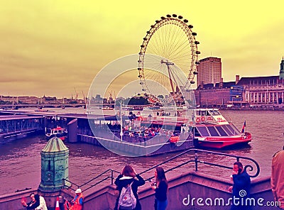 London's eye with tourists outdoor london UK Editorial Stock Photo