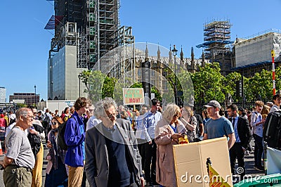 Climate Change protesters demonstrating in Parliament Square, London with The Houses of Parliament in the background Editorial Stock Photo