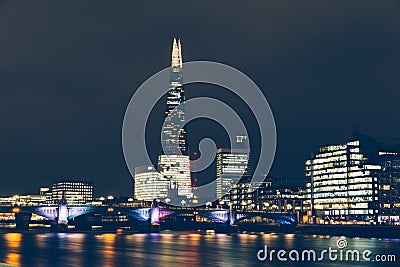 London skyline at night with shard building and reflections on R Stock Photo