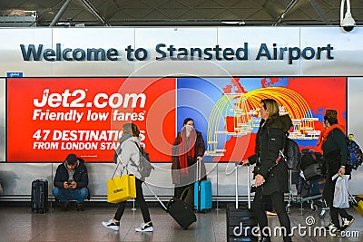 Welcome sign in London Airport, few days before Brexit many travellers stroll in Stansted Airport Editorial Stock Photo