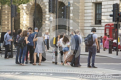 london, U.K., August 22, 2019 - asian group of tourists, visitors crossing the street in loondon Editorial Stock Photo