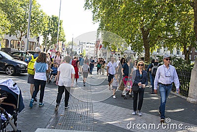 London, U.K. August 22, 2019 - People wlking in the street, summer day Editorial Stock Photo