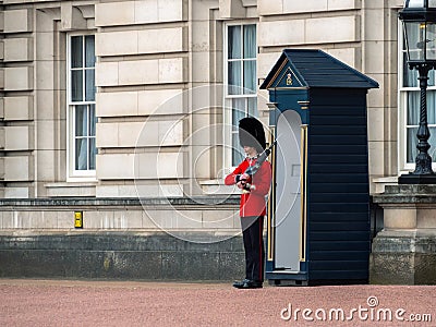 English soldier patrolling at Buckingham Palace Editorial Stock Photo