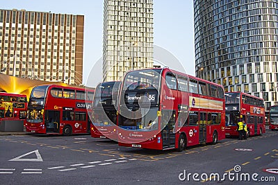 LONDON, UK - August 22, 2019 - many red english buses at Stratford international train, tube and bus station Editorial Stock Photo