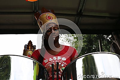 Notting Hill Carnival Beautiful Afro-American girl playing drums Editorial Stock Photo