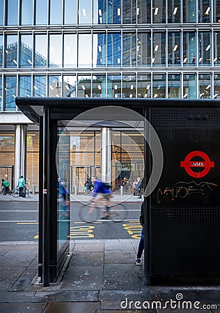 London, UK: Bus stop on Bishopsgate in the City of London with cyclist Editorial Stock Photo