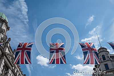 Close up of building on Regent Street London with row of British flags to celebrate the wedding of Prince Harry to Meghan Markle Stock Photo