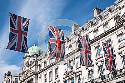 Close up of building on Regent Street London with row of British flags to celebrate the wedding of Prince Harry to Meghan Markle Stock Photo