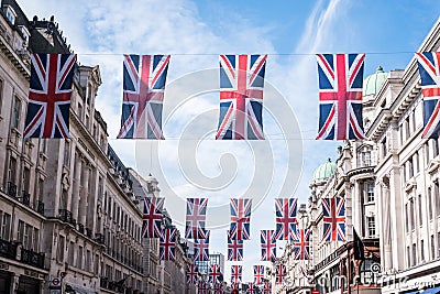 Close up of buildings on Regent Street London with row of British flags to celebrate the wedding of Prince Harry to Meghan Markle Editorial Stock Photo