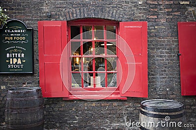 Window with red shutters, decorated with a drawing with a horse in a traditional Christmas Editorial Stock Photo
