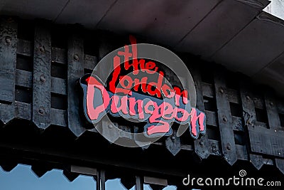The London Dungeon sign at the entry of the building, scary and creepy tourist attraction in London Editorial Stock Photo
