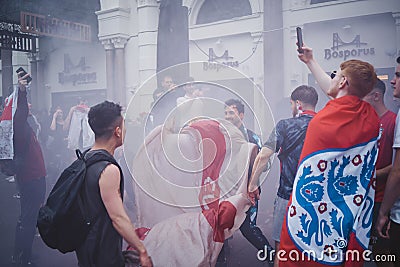 English fans waving flags at Leicester Square before the final Euro 2020 Football game Editorial Stock Photo