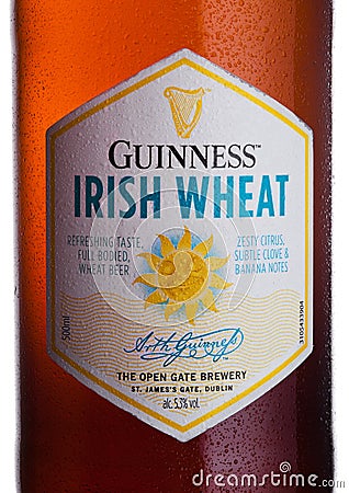 LONDON, UK - FEBRUARY 02, 2018: Bottle lable of Guinness Irish Wheat beer on white. Editorial Stock Photo