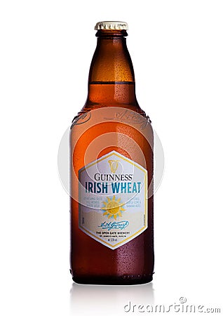 LONDON, UK - FEBRUARY 02, 2018: Cold bottle of Guinness Irish Wheat beer on white. Editorial Stock Photo