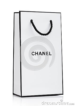 LONDON, UK - JANUARY 15, 2019: Paper Chanel shopping bag, white with black stripes and letters on white background Editorial Stock Photo