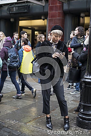 Fashionable people on the street . Street style Editorial Stock Photo