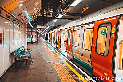 London UK January 2021 Underground Tube metro train stopped on a platform station in London, doors open with no people, UKs Editorial Stock Photo