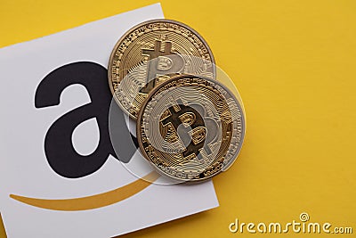 LONDON, UK - July 2021: Bitcoin cryptocurrency on an amazom e-commerce logo Editorial Stock Photo