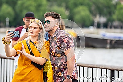 London, UK, July, 2019. Close up portrait of happy attractive couple taking selfie in London Editorial Stock Photo