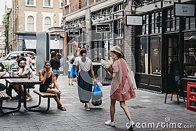 People walking in Spitalfields Market, London, UK. Editorial Stock Photo