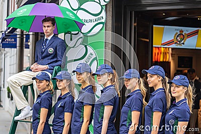 London, UK, July 14, 2019. Photographer taking pictures of sporty models near Polo Ralph Lauren shop. Free public event Regent Editorial Stock Photo
