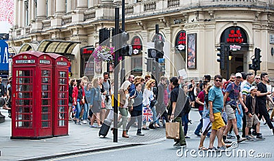 London, UK. Lots of walking people, tourist and Londoners on the Piccadilly street Editorial Stock Photo