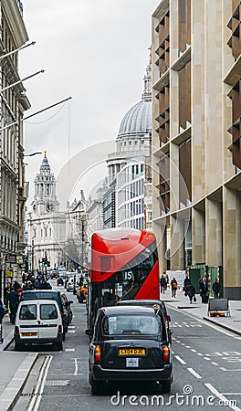 Heritage red Routemaster Bus operating in the City of London. Open platform at back facilitated speedy boarding under Editorial Stock Photo