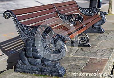 Camel design wooden bench on Victoria embankment in London on March 11, 2019 Editorial Stock Photo