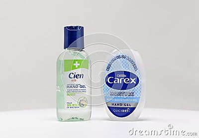 London / UK - March 22nd 2020 - Two bottles of antibacterial hand sanitiser gel from Carex and Cien brands on a white background Editorial Stock Photo